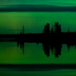 Northern Lights and Clouds: Northern lights over Devil Track Lake near Grand Marais, Minnesota.