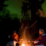 Northern Lights and Campfire: Northern Lights over the Pigeon River near Grand Portage, Minnesota.