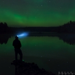 Standing on the Heavens: Self Portrait of me standing on a lake under the northern lights.