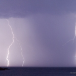 Strikeshop: A composite of two images shot one right after the other from the same tripod. Lightning strikes Lake Superior.