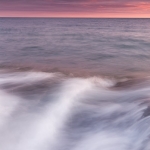 Winter Sunset at Butterwort Cliffs: The sun sets over Lake Superior at Butterwort Cliffs SNA in winter. Minnesota.