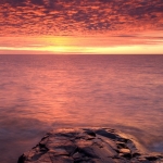 Lake Superior Sunrise: The sun sets the sky on fire over Lake Superior.g