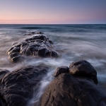The Point: The moon over Lake Superior and a rocky point.