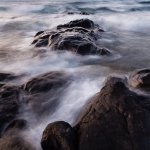 Waves and Basalt: Waves wash over a basalt point on Lake Superior.