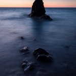 Lake Superior Sea Stack: A lone sea stack on Lake Superior at sunrise.