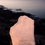 Ice and Sun: The sun paints ice orange and pink.