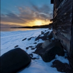Colville Fish House: An unused Colville fish house witnesses another Lake Superior sunset during winter. Colville, Minnesota.