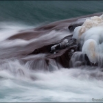 Waves of the Ice: Waves washing over the icy Lake Superior shoreline. Last night's southwest winds gusting to 30 mph built waves on the big lake. This is the result.

Image: 110124-31

Note: I almost never increase the saturation in my photos. I did for this one. Hopefully, it's not too guady.