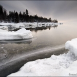 Cold Morning on Lake Superior: A gray sky over a frozen inlet on Lake Superior. Minnesota.