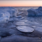 Breaking Up: The ice sheets and pack ice breaks up as southerly winds drive waves at the Lake Superior shoreline.

110203-49