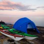 The sun sets of Lake Superior on a kayak campsite near Grand Marais, MN.