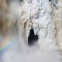 Spring runoff starts to eat away the ice on the High Fall of the Pigeon River. Minnesota.