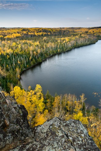 Honeymoon Bluff overlooks Hungry Jack Lake. The birch in yellow fall color brighten up the boreal forest.
