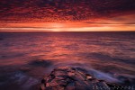 The sun sets the sky on fire over Lake Superior.