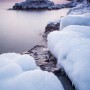 Frozen shoreline on Lake Superior at the end of January. Sunset at Cascade River State Park, Cook County, Minnesota.
