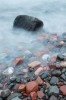 lake superior waves roll over rocks