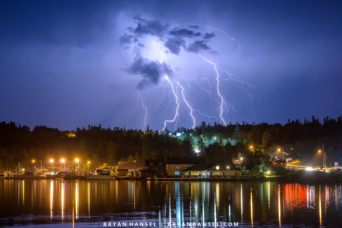 Lightning over the city lights of Grand Marais. The yellow lights are the old lights. The blue lights are the new.