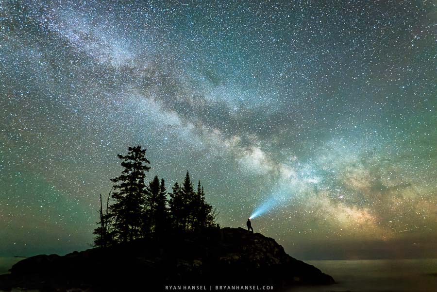 A self-portrait standing on the tombolo island under the night sky and the Milky Way. Cook County, Minnesota.